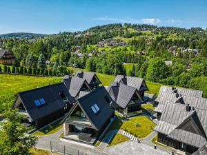 an overhead view of a row of houses with roofs at Crystal Peak Villas z prywatnym jacuzzi, Odkryj-Zakopane in Kościelisko