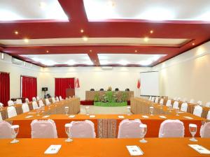 a large banquet hall with long tables and chairs at Grand Tryas Hotel in Cirebon