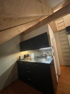 a kitchen with a sink and a counter top at Modernes und schönes Apartment VS in Villingen-Schwenningen