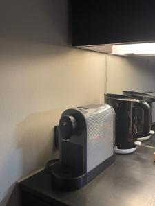 a toaster oven sitting on a counter in a kitchen at Modernes und schönes Apartment VS in Villingen-Schwenningen