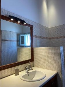 a bathroom with a sink and a mirror at EnjoyPatmos in Skala +14 photos