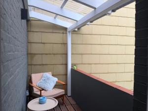 an outdoor patio with a chair and a skylight at Apartment Itzehoe in Itzehoe