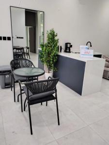 a cafe with chairs and a table and a counter at شاليهات ترف in Abha