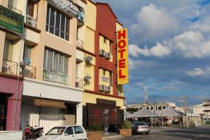 a building with a hotel sign on a street at Hotel Seremban Jaya in Seremban