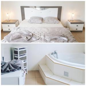 a bedroom with a bed and a bath tub at Villa enchanteresse à Saint-Benoît avec piscine privée in Saint-Benoît +31 photos