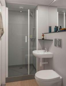 a bathroom with a shower and a toilet and a sink at Charming studio in Moka 40 m² with mountain view terrace in Moka