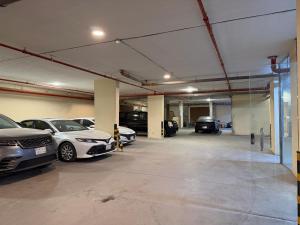 a garage with several cars parked in it at اكارم - إشبيلية - Akarem - iishbilia - اقتصادي in Riyadh