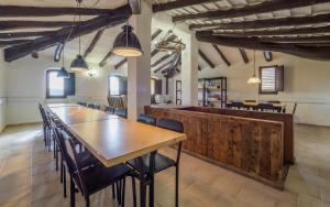 a dining room with a long table and chairs at Spacious House in Can Trabal in Can Trabal +36 photos