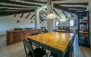 a dining room with a wooden table and chairs at Spacious House in Can Trabal in Can Trabal