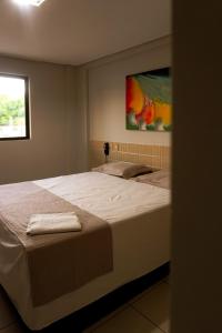 a bedroom with a large bed in a room at Hotel Tupinambá Timon in Timon +61 photos