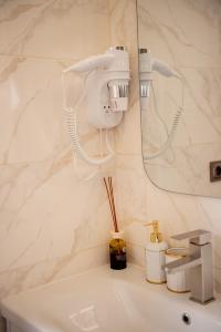 a bathroom with a white sink and a mirror at Hotel Taurus in Solotvyno +113 photos