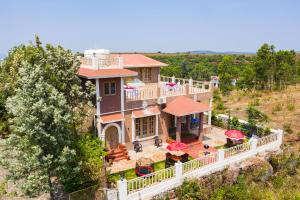 an overhead view of a large house with a balcony at TAJ VILLA Mahabaleshwar in Mahabaleshwar