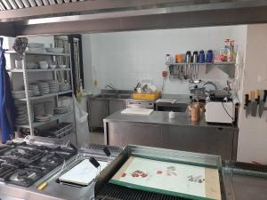 a kitchen with a stove top in a kitchen at Spacious villa with private pool and stunning views in Bompensiere