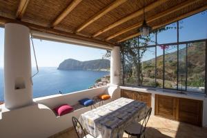 a balcony with a view of the ocean at House with garden and sea view in Lipari in Lipari +14 photos