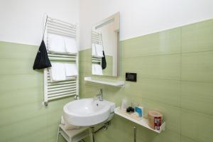 a bathroom with a sink and a mirror at Hotel Venere Azzurra in Lerici +51 photos