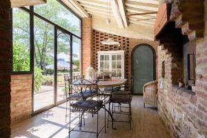 a dining room with a table and chairs at Charming House in Trequanda + Pool in Trequanda