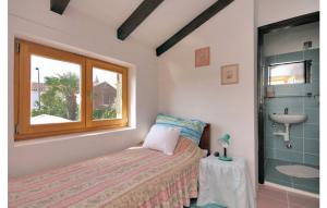 a bedroom with a bed and a sink and a window at Charming Villa in Jezera with Private Pool in Jezera +32 photos