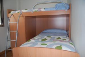 Posteľ alebo postele v izbe v ubytovaní Apartamentos Cedeira