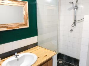 a bathroom with a sink and a shower at Charming Studio in Grand Baie, 60 m² with Shared Pool in Grand-Baie +17 photos