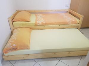 two bunk beds sitting next to each other in a room at Charming Apartment in Pag with Sea View, 40 sqm in Pag
