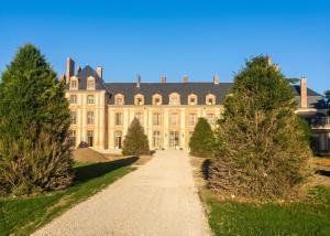 an old mansion with trees in front of it at Charmant studio à Abondant avec terrasse ensoleillée - 30 m² in Abondant