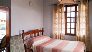 a bedroom with a bed and a window at Charming studio with sea-view terrace in Souillac - 22 m². in Souillac