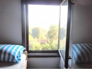 a window in a room with a view at Cozy House in Jazvine with Garden in Jazvine