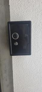 a black electrical outlet on a wall at Taksim Apartman in Igalo