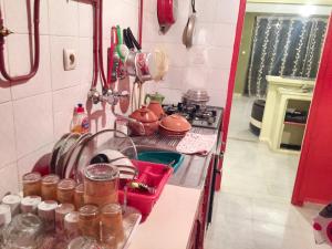 a kitchen with a sink with pots and pans at Stylish apartment in El Marsa 75 m² sea view in El Marsa