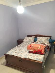 a bedroom with a bed with two pillows on it at Stylish apartment in El Marsa 75 m² sea view in El Marsa