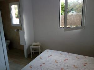 a white bedroom with a bed and a window at Seaside Villa in Calafat with Private Pool. in Calafat +21 photos