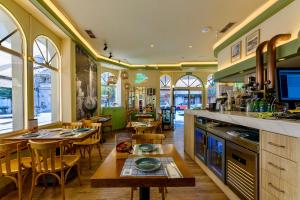 a restaurant with a table and some chairs and tables at Hostal Costa Coruña in A Coruña