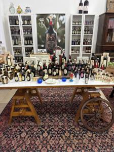 a table filled with lots of bottles of wine at Art & Breakfast in Ripabottoni