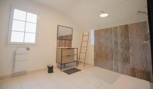 a bathroom with a sink and a mirror and a dresser at Chez annie in Onjon +10 photos