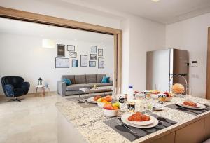 a kitchen with a table with fruit on it at La Brise De Gammarth in Gammarth