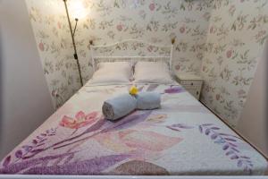 a bedroom with a bed with a stuffed animal on it at Barnhouse Duplex in Idanha-a-Nova +36 photos