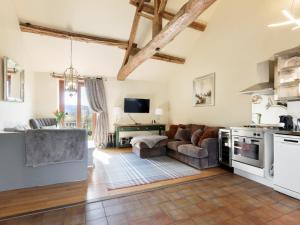 a kitchen and living room with a couch and a table at Priest Hill-Rxx7 in Stanton in Peak +16 photos