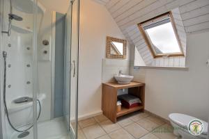 a bathroom with a shower and a sink at La maison des charretiers in Cohiniac +21 photos