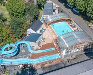 an overhead view of a water park with a pool at Camping La Clé des Champs in Saint-Nectaire +19 photos