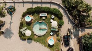 an overhead view of a swimming pool in a resort at Ca Meison in Cannobio