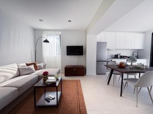 a living room with a couch and a table at Terra Vivaz - Porto Bay Formosa in Porto Formoso