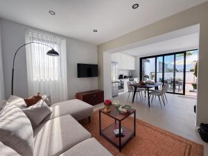 a living room with a couch and a table at Terra Vivaz - Porto Bay Formosa in Porto Formoso
