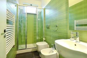 a bathroom with a sink and a toilet and a shower at Comfortable Studio in Nicolosi, 25 m² in Nicolosi