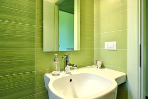 a bathroom with a sink and a mirror at Comfortable Studio in Nicolosi, 25 m² in Nicolosi +24 photos