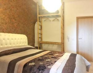 a bedroom with a bed and a bunk bed at Charming House in Gallipoli + Terrace in Gallipoli