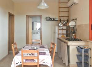 a kitchen with a table with chairs and a stove at Charming House in Gallipoli + Terrace in Gallipoli