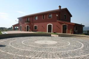 a building with a large stone labyrinth in front of a building at Exquisite Retreat in Segni in Colleferro