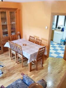 a dining room with a table and chairs at Comfortable Apartment in Astorga + Terrace in Astorga +4 photos