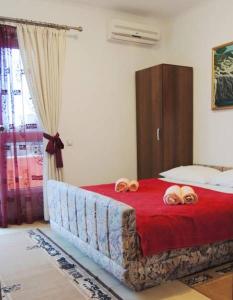 a bedroom with a bed with two towels on it at Sea View Apartment - Ulcinj - 40 sqm in Ulcinj