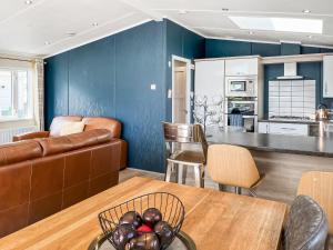 a living room with a couch and a table at Serenity At Lakeside - Uk51947 in Patrington